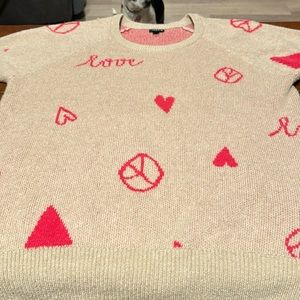 Torrid sweater darling.  Great for V-Day. Size 2. Peace signs and hearts.